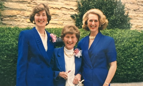 A portrait of three women dressed professionally.
